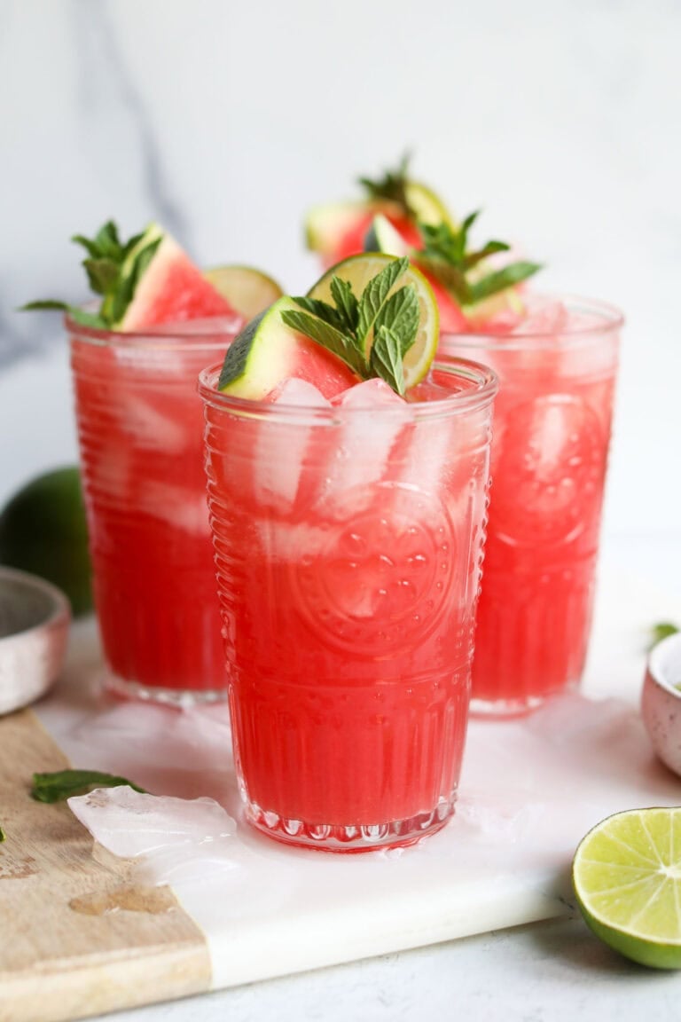 Three tall glasses filled with watermelon mocktail drink